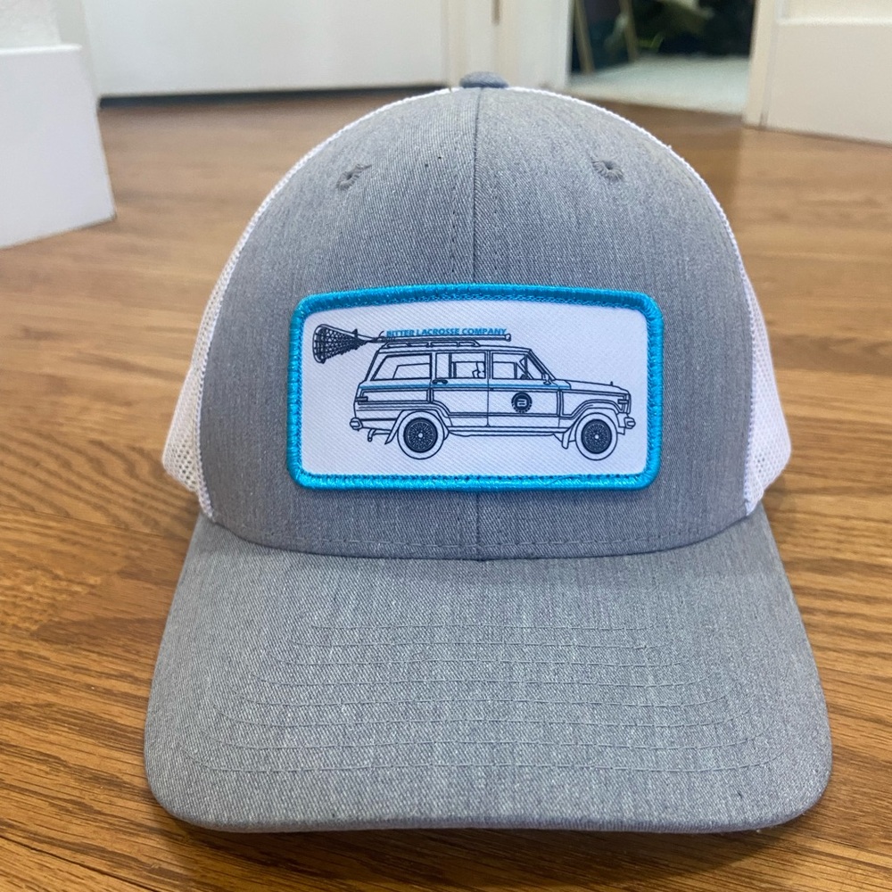 Bitter Lacrosse Company Gray and White Trucker Hat with aqua patch